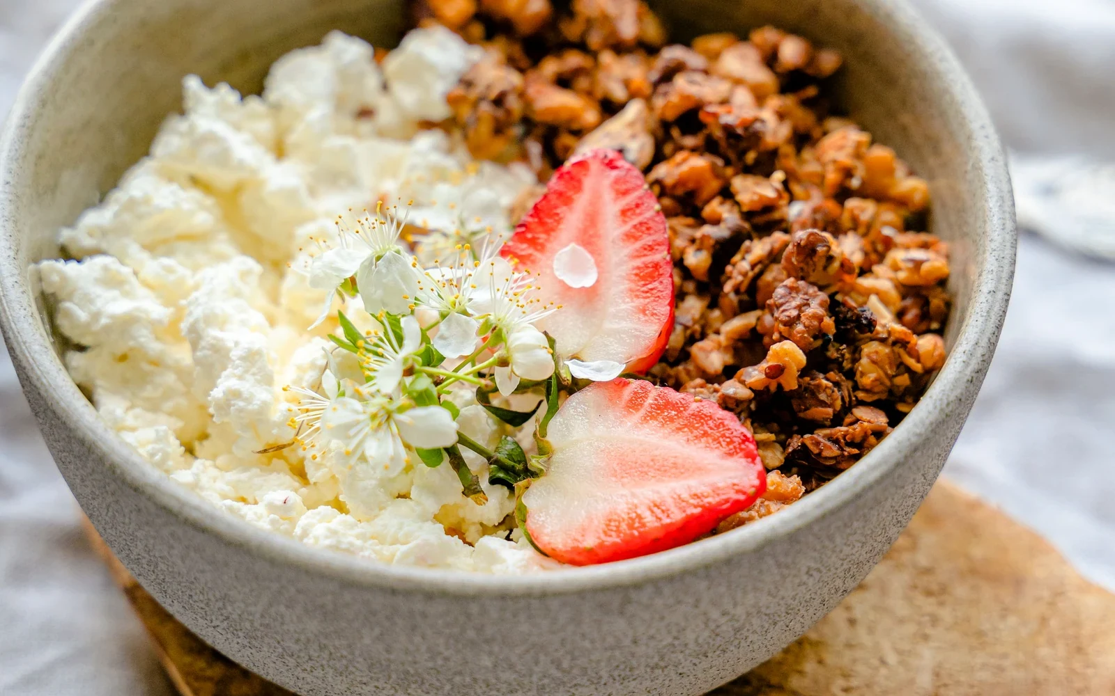 Cottage cheese bowl with granola and strawberries