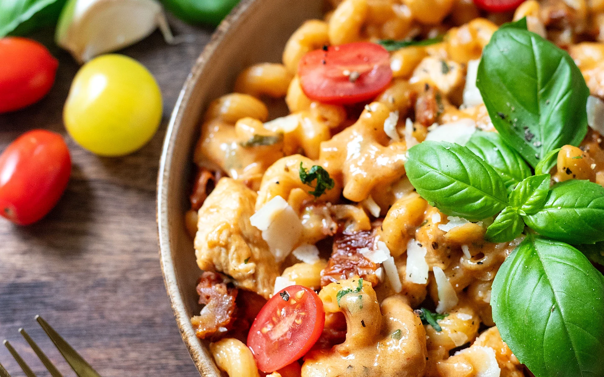 Creamy pasta with cherry tomatoes and fresh basil